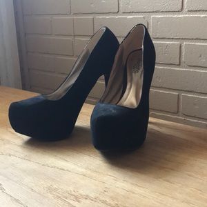 Woman’s black high heels